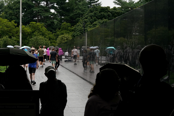 People visit the Korean War Veterans Memorial in Washington, U.S., July 26, 2022. REUTERS/Elizabeth Frantz