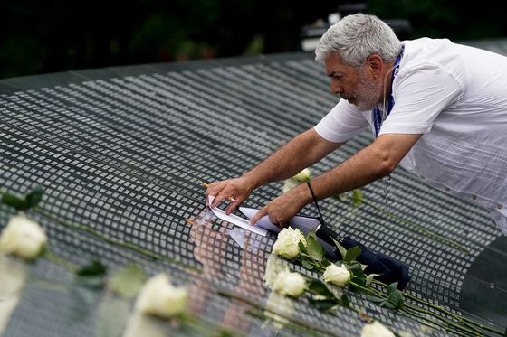 People visit the Korean War Veterans Memorial in Washington, U.S., July 26, 2022. REUTERS/Elizabeth Frantz