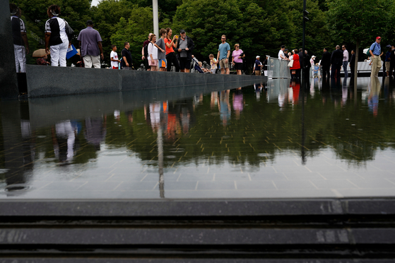 People visit the Korean War Veterans Memorial in Washington, U.S., July 26, 2022. REUTERS/Elizabeth Frantz