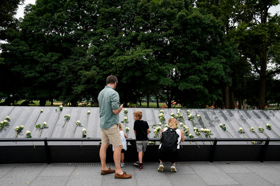 People visit the Korean War Veterans Memorial in Washington, U.S., July 26, 2022. REUTERS/Elizabeth Frantz