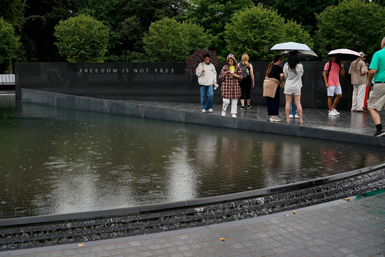 People visit the Korean War Veterans Memorial in Washington, U.S., July 26, 2022. REUTERS/Elizabeth Frantz