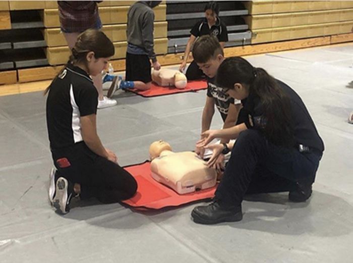 The Saving Hearts Foundation teach students and others on how to perform CPR [Source: Valencia High School’s Medical Science Academy]