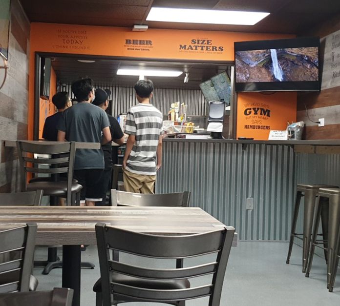 Customers using Munch’s promotion at TJ’s Cafe Restaurant [Source: Author, Lauren Yu]
