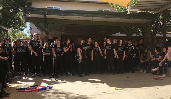 Valencia High School’s choir prepares to perform at the Gilchrist Farm stage.