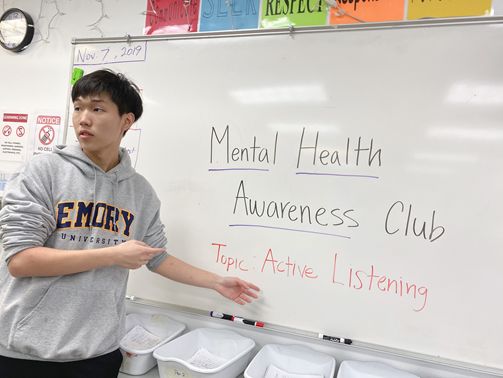 Enoch Lee, one of the presidents of the Mental Health Awareness Club, is leading a class presentation on the art of active listening.