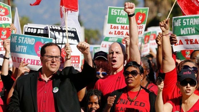 President of the United Teachers Los Angeles, Alex Caputo-Pearl, joins a rally for the teachers. [Source: Associated Press, Damian Dovarganes]