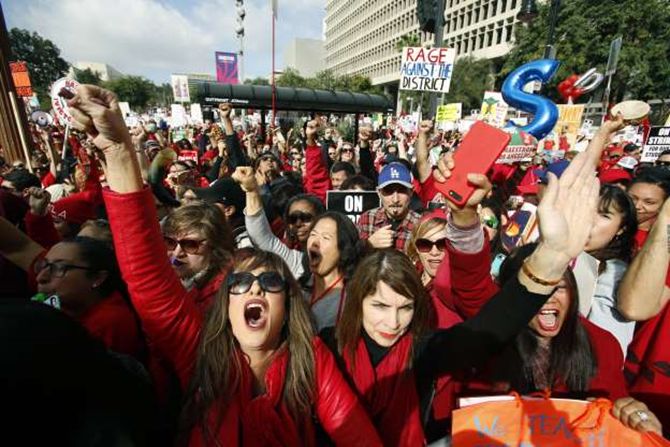 On the 5th day of the teacher’s strike outside of City Hall where many people, including students and parents, went in support of the teachers. [Source: Associated Press, Damian Dovarganes]