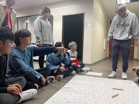 The church youth members are playing Yut-nori. Although most of them were born in America, they all enjoy this traditional game due to its simplicity! 